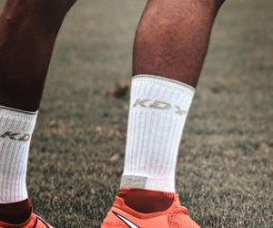 Close-up of feet on a mat, showing balance and stability.