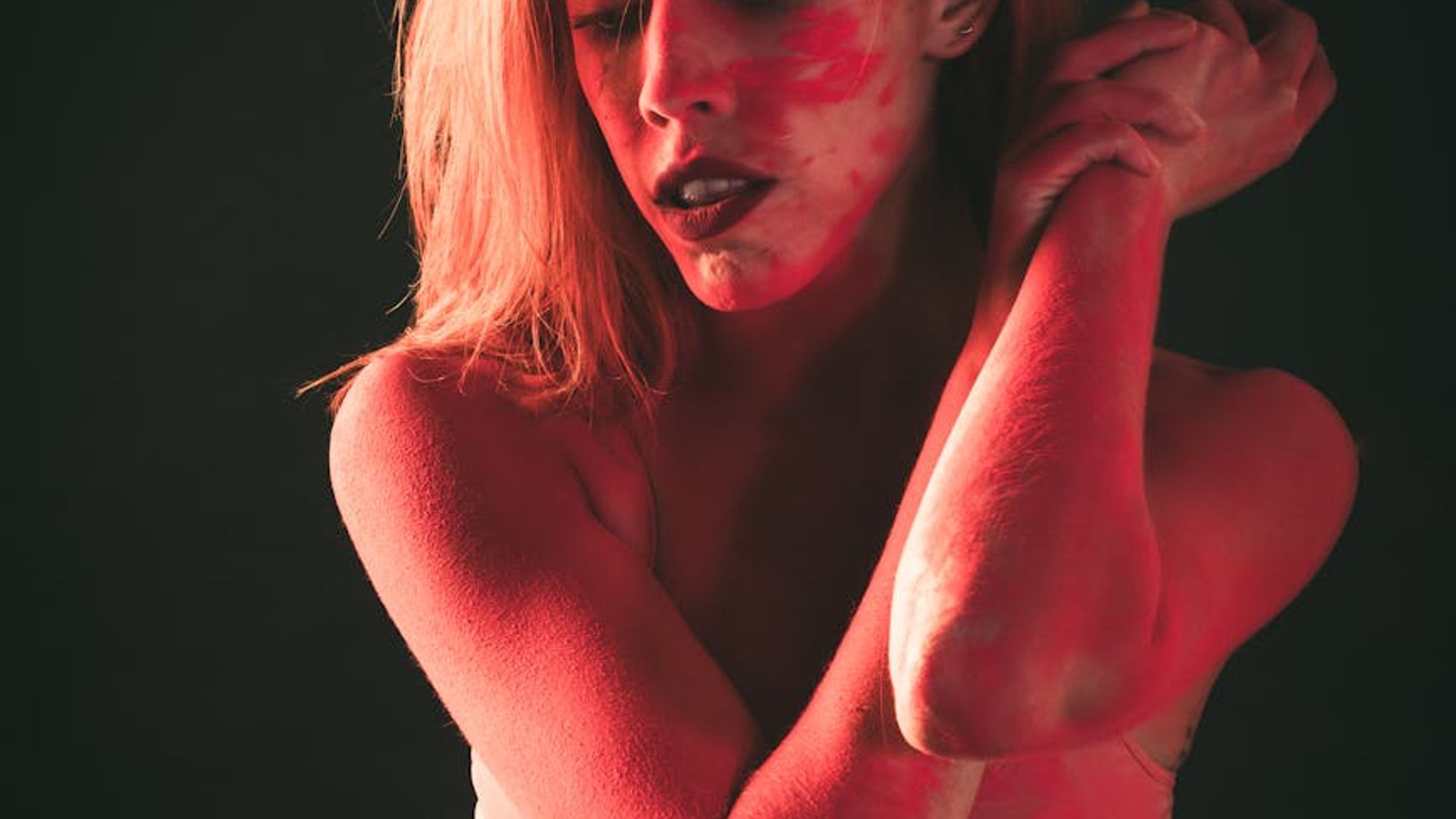 Silhouette of a person in a dynamic, fluid motion against a dark background.